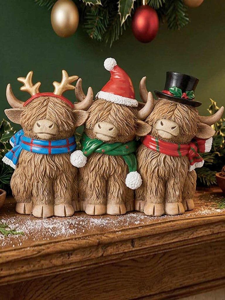Three Christmas Highland Cows